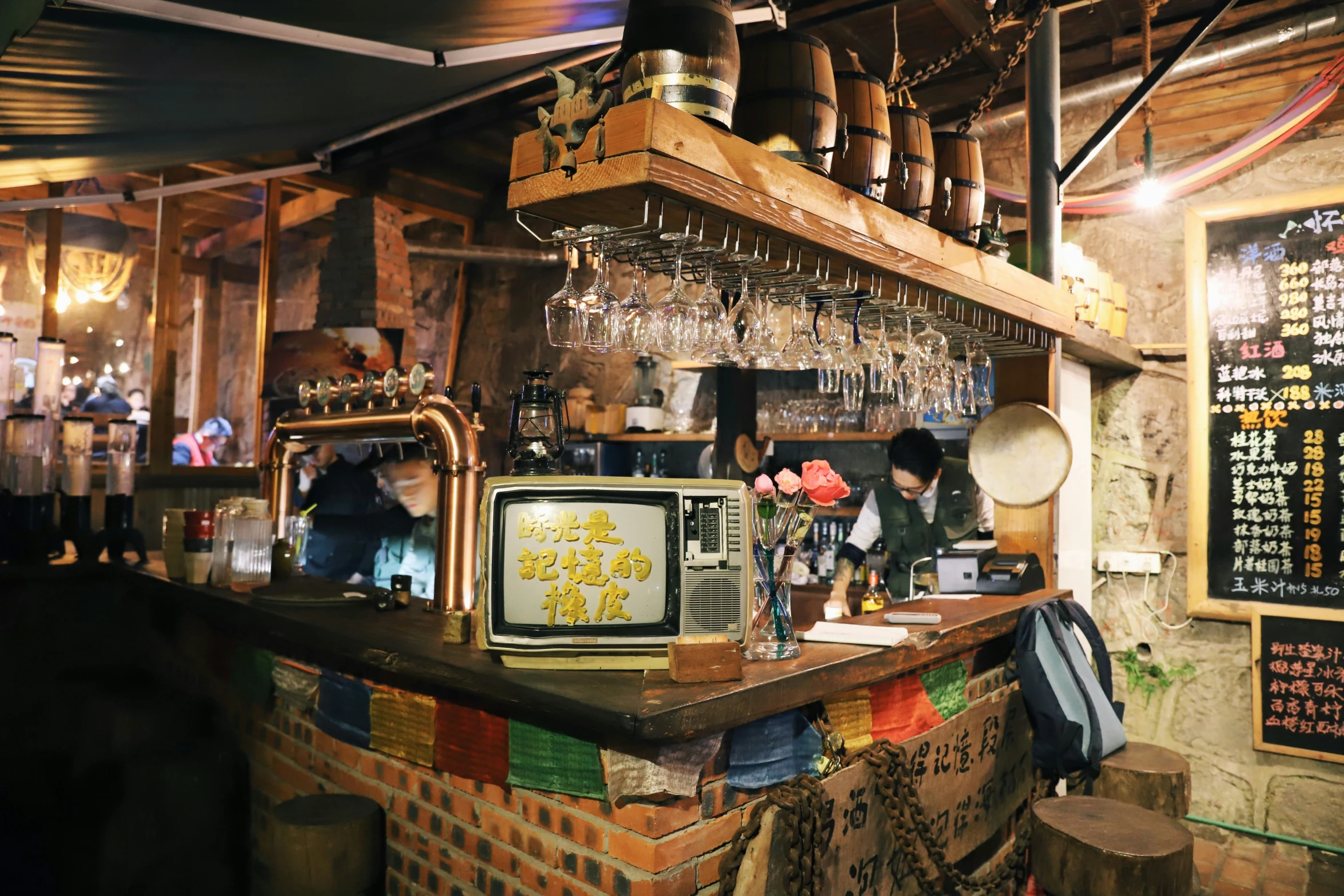 a man is at the bar with many bottles on it