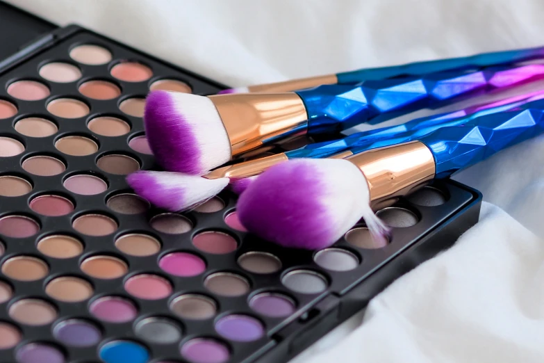 makeup products displayed on a sheet of paper