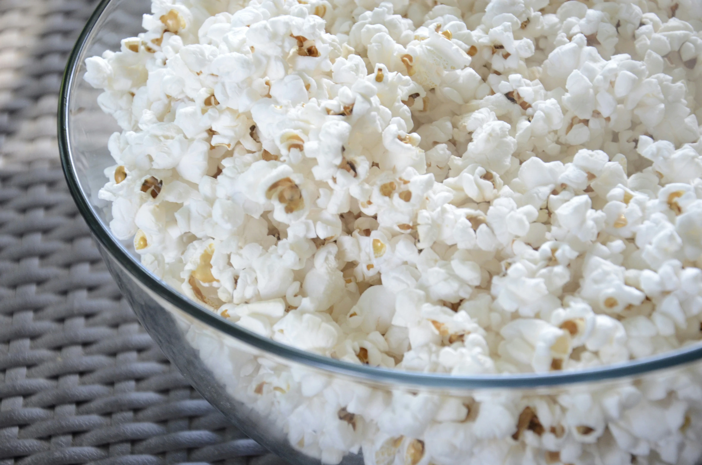 a bowl filled with white cauliflower sitting on top of a table