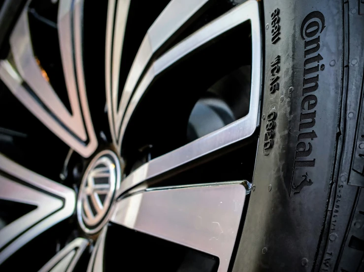 a close up view of a tire of a car