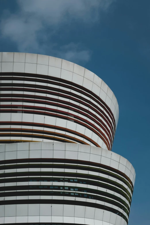 an architectural structure of various lines against a bright blue sky