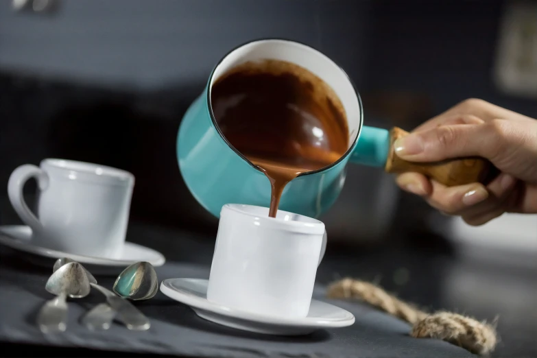 a cup filled with liquid sitting on a saucer