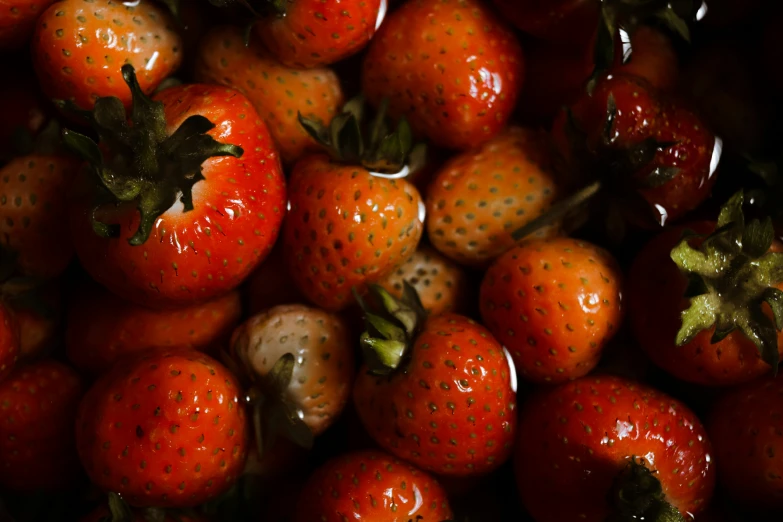 a close up of strawberries with a lot of small dots