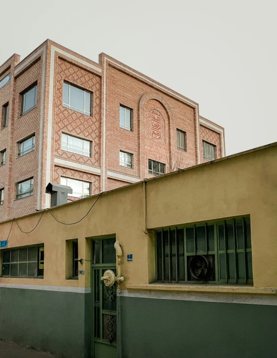 a building made from brick in front of the wall