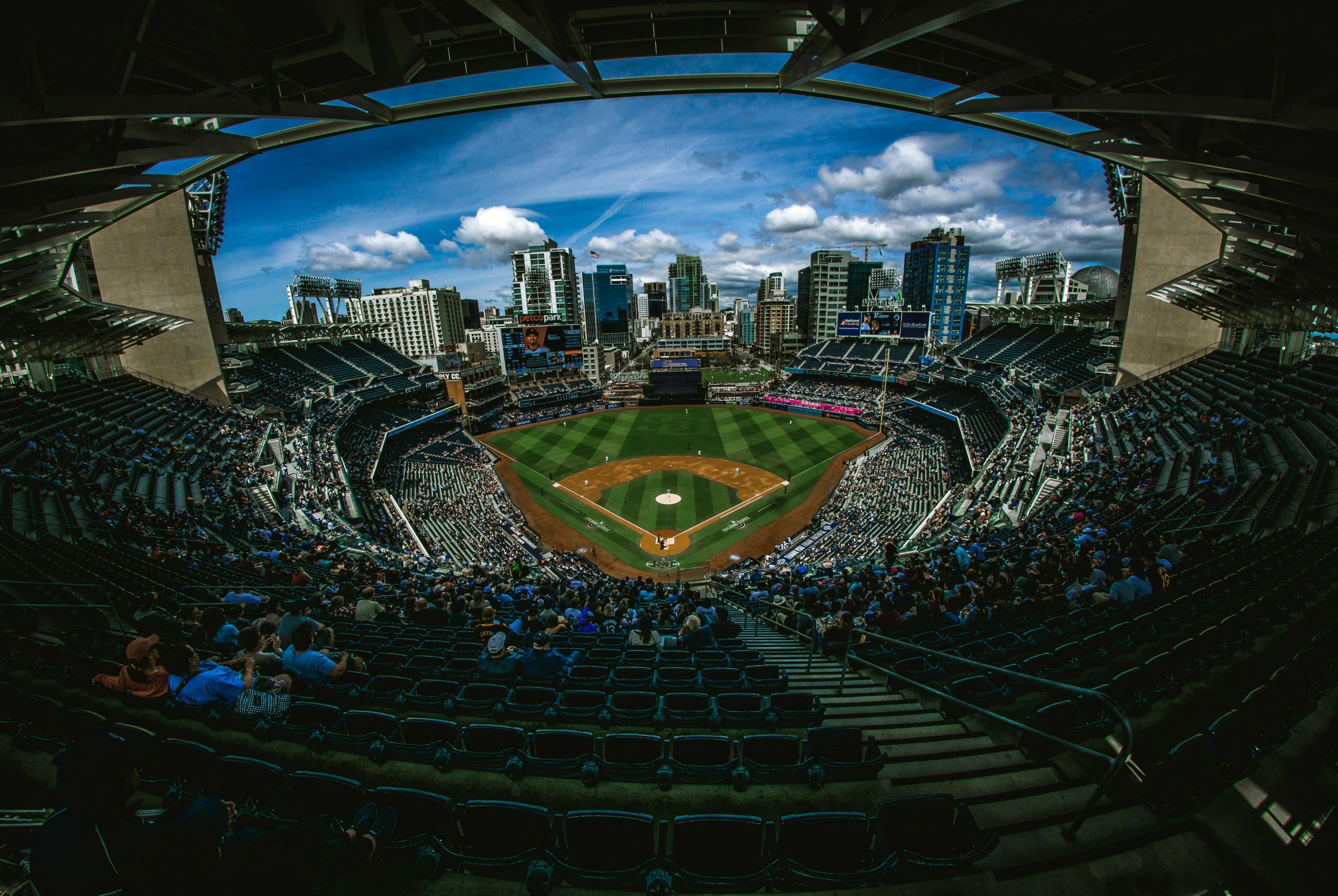 a baseball stadium filled with spectators and onlookers