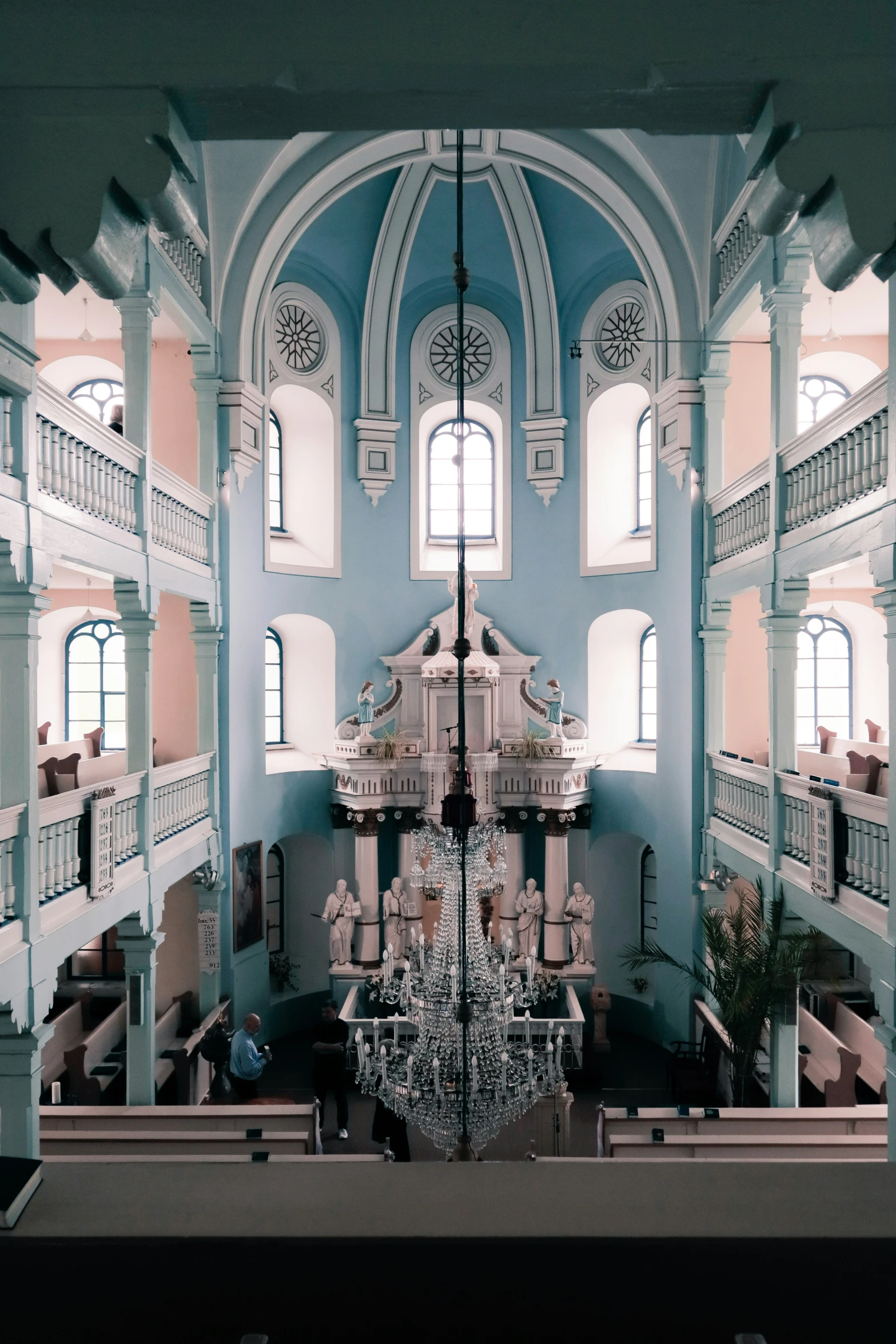 the inside of a building that has lots of tall windows