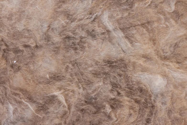 a piece of brown fur sitting on top of a floor