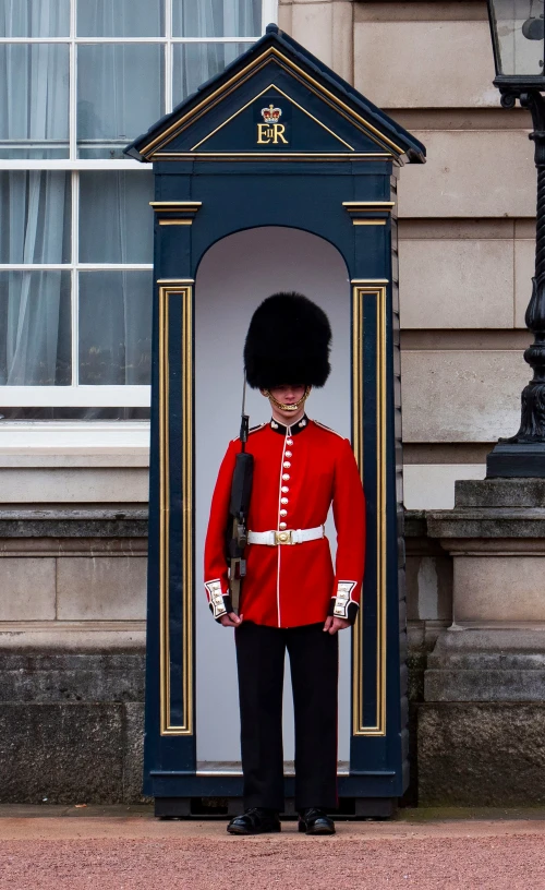 a guard is standing in front of an open doorway