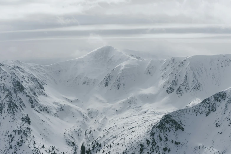 snow covered mountains are seen in this view