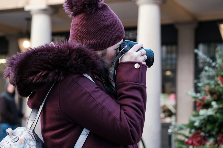 a woman taking a pograph with her camera