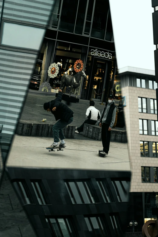 two people doing tricks on skateboards in a city street