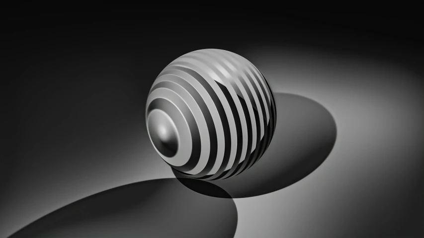 a round object in black and white on a black background