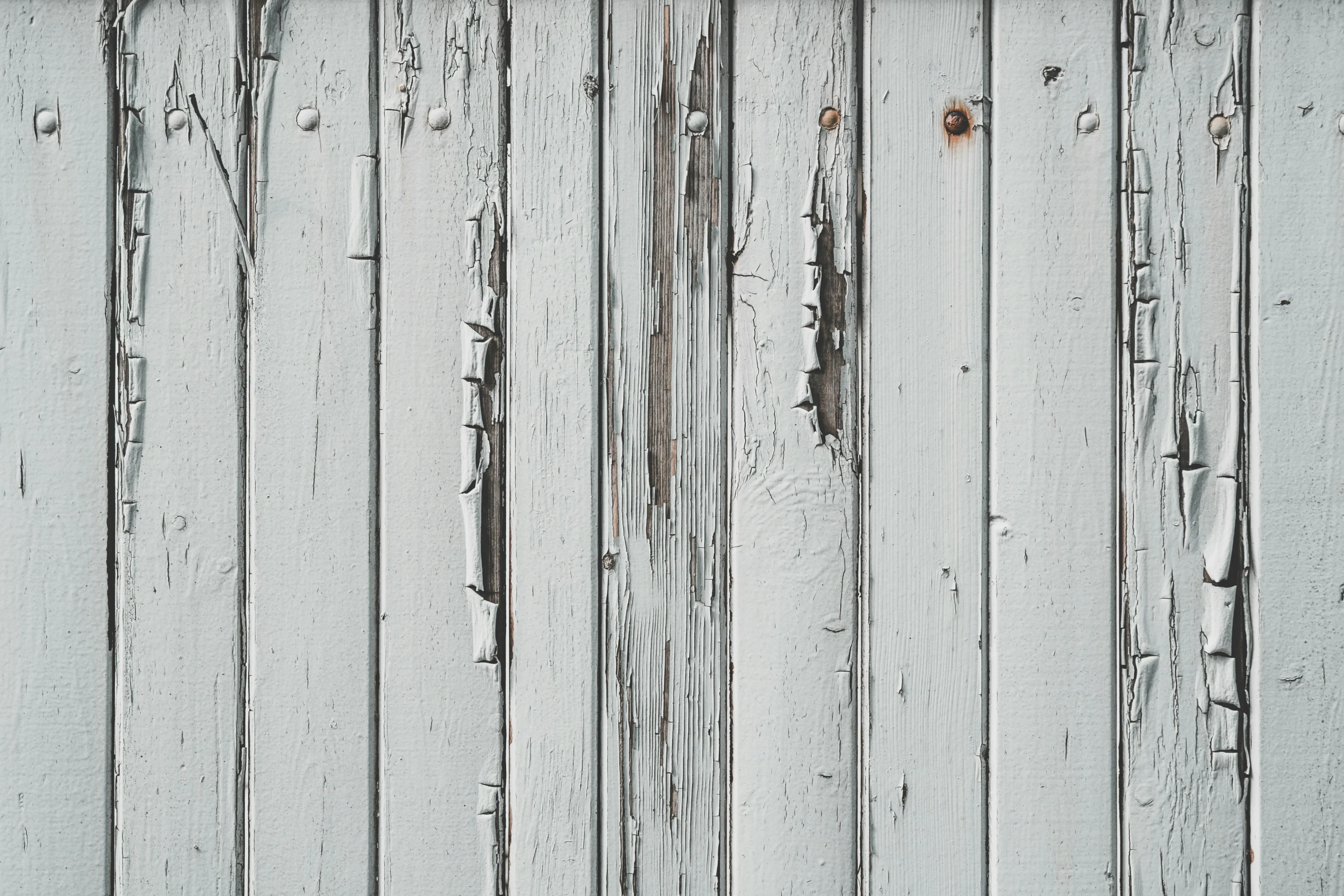 an old wooden paneled wall in black and white