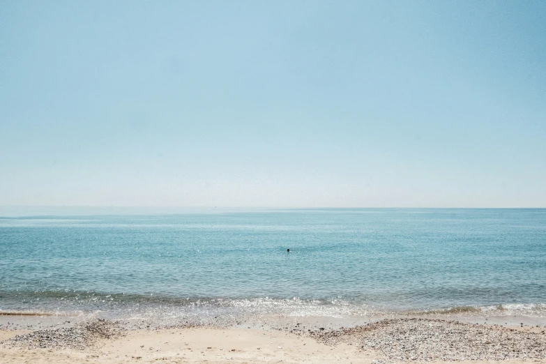 there is a small ocean beach in the sand