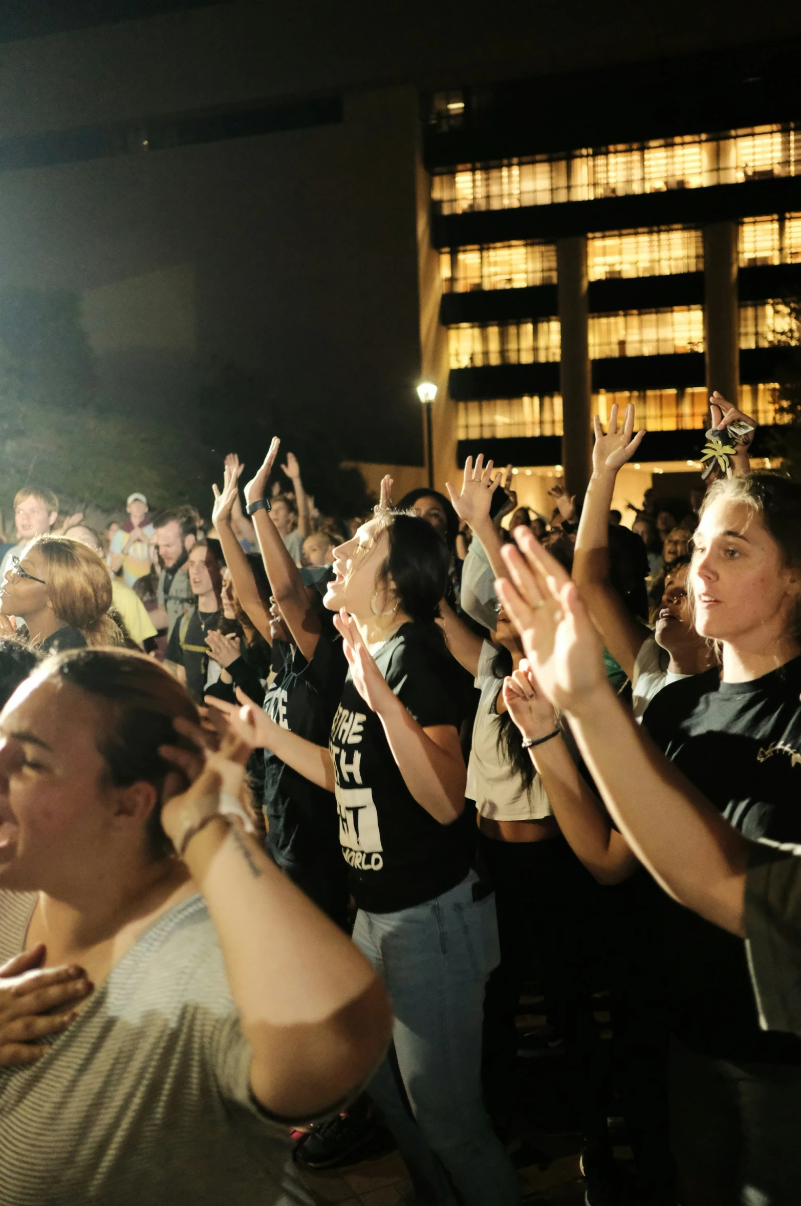 a large group of people clapping