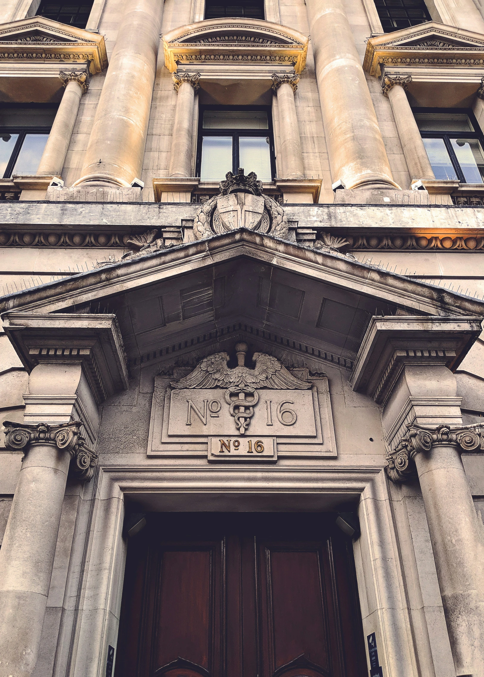 front of an ornate stone building with two doors