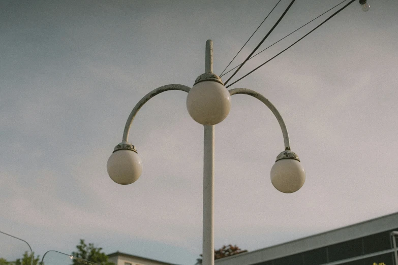 a large street light with two white balls on top