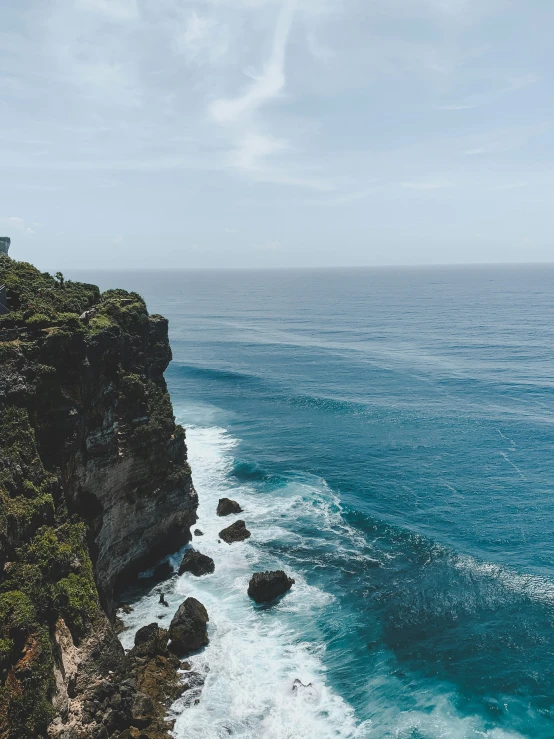 a scenic cliff that stretches across the ocean near cliffs