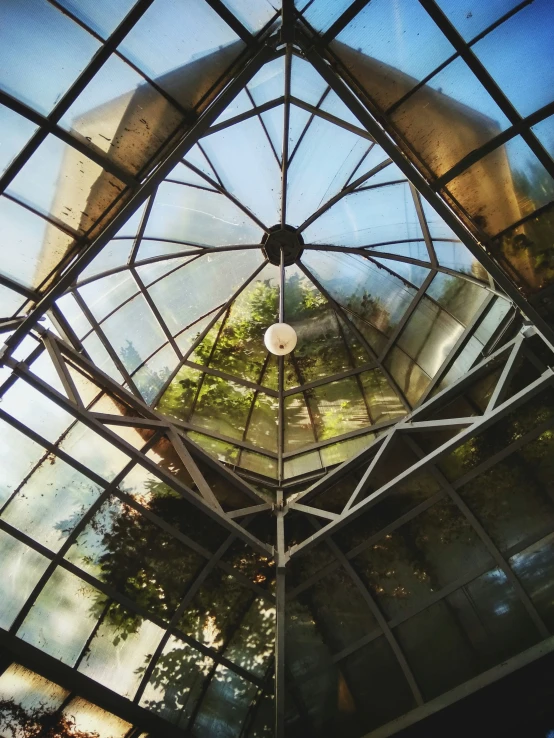 a ceiling mounted to the side of a tall building