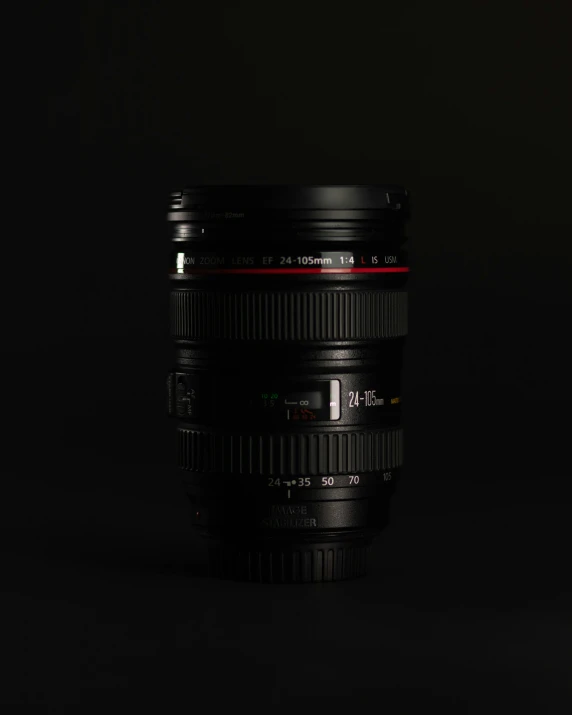 a lens on a black background with red stripes
