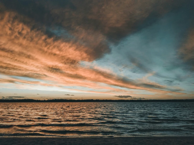 the ocean is covered with a layer of clouds