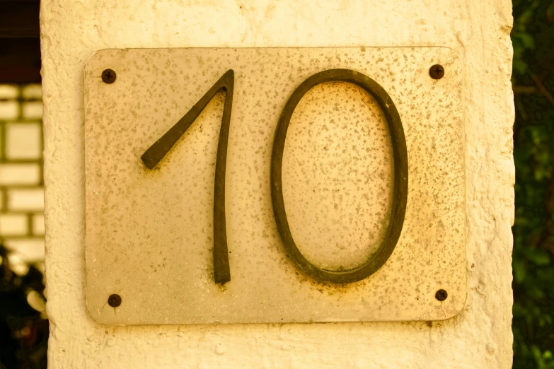 a sign that says 10 in a black font