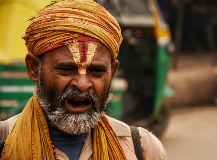 a man with a very interesting hair style and a beard