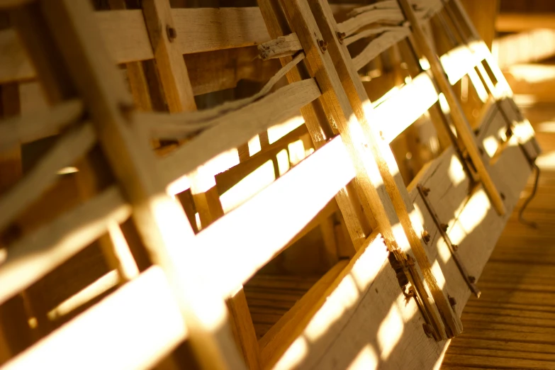 a row of benches covered in wooden slats