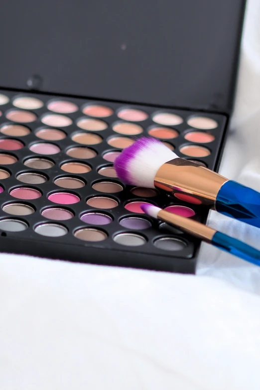 makeup and beauty products sitting on a table