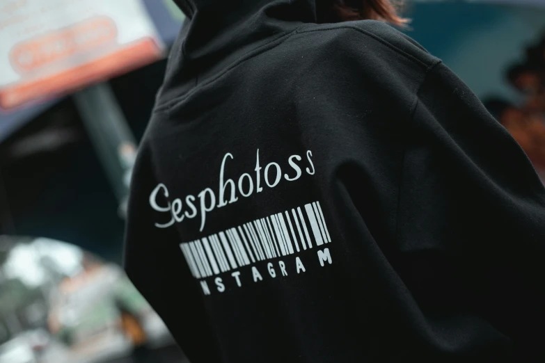 a bar code on the back of a hooded sweatshirt