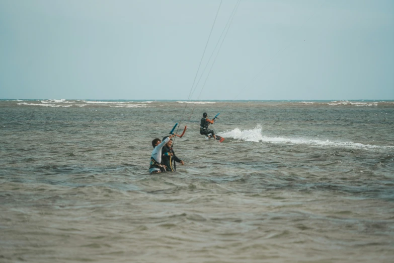 two people on surfboards in the water