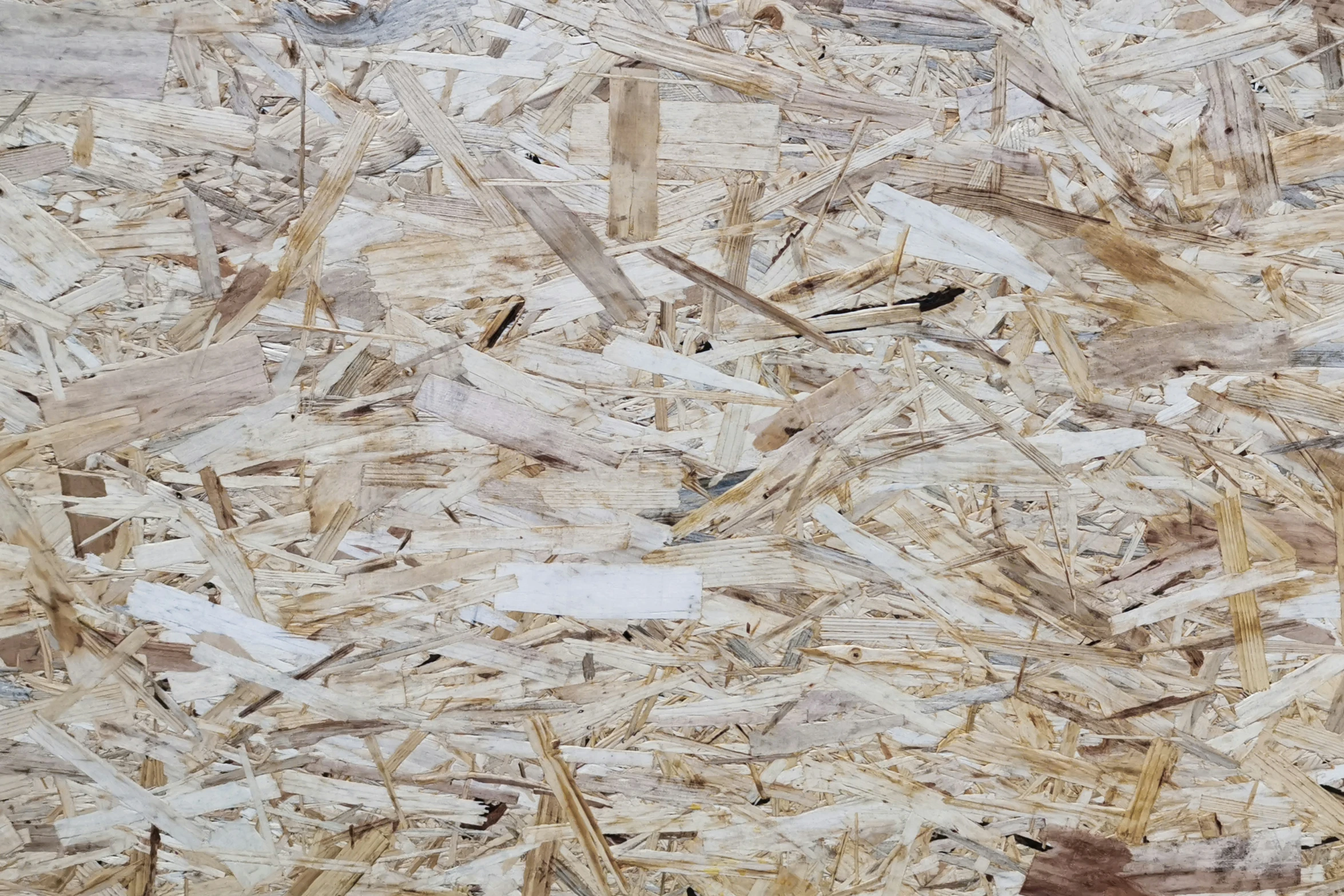 a pile of brown and white wood chipped together