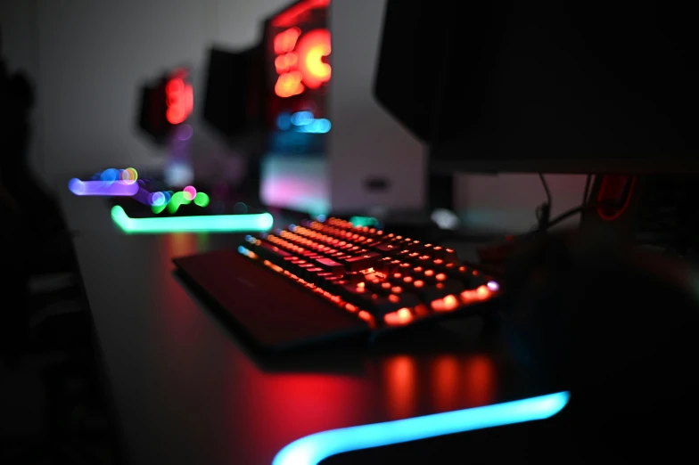 an illuminated keyboard and mouse on a table