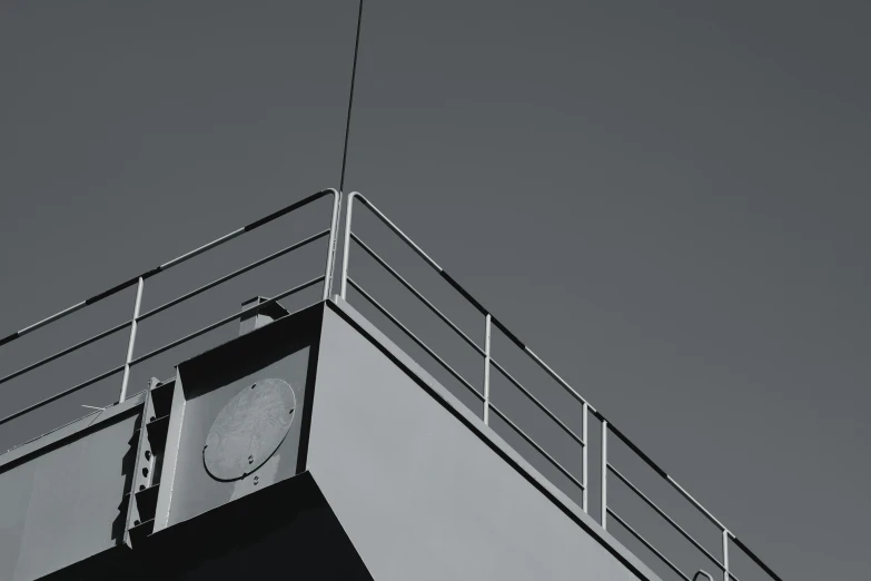 a clock on the side of a tower against a sky