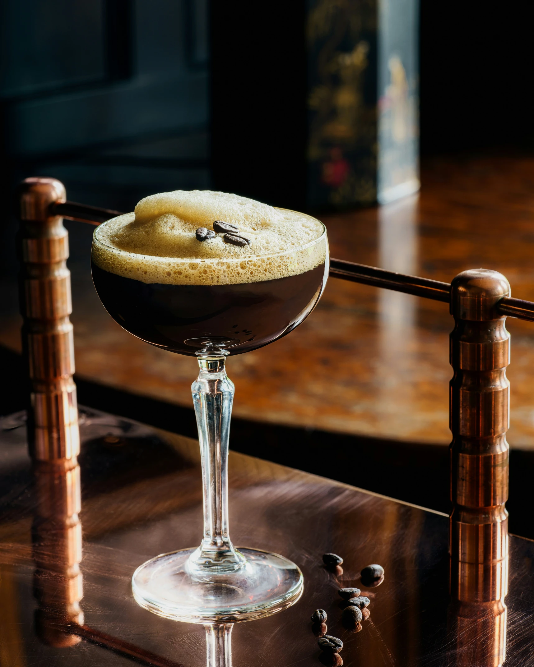 a dessert on a glass sitting on top of a wooden table