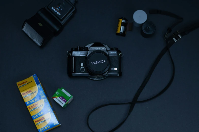 various items are sitting next to a camera