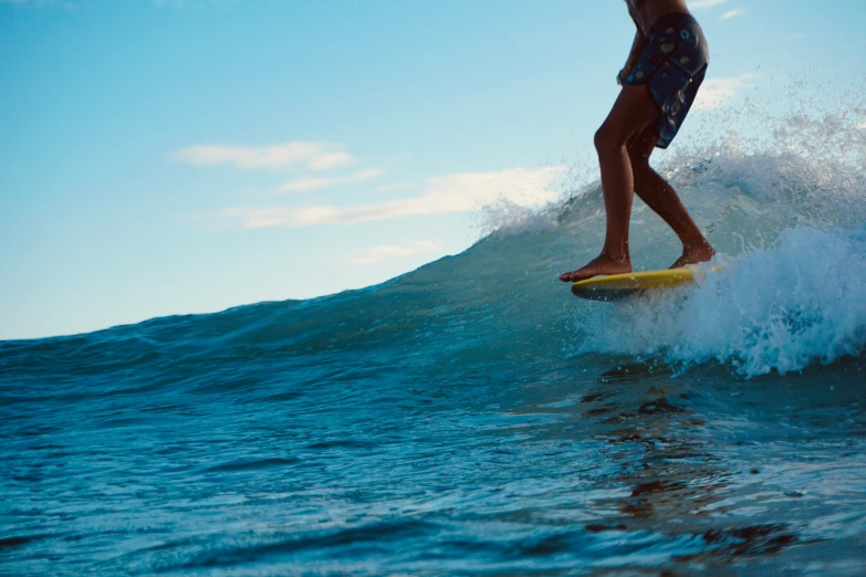 a surfer is riding the small waves on his surfboard