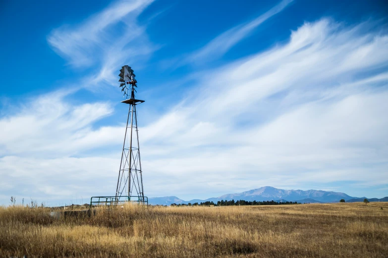 a wind turbine on a large open field