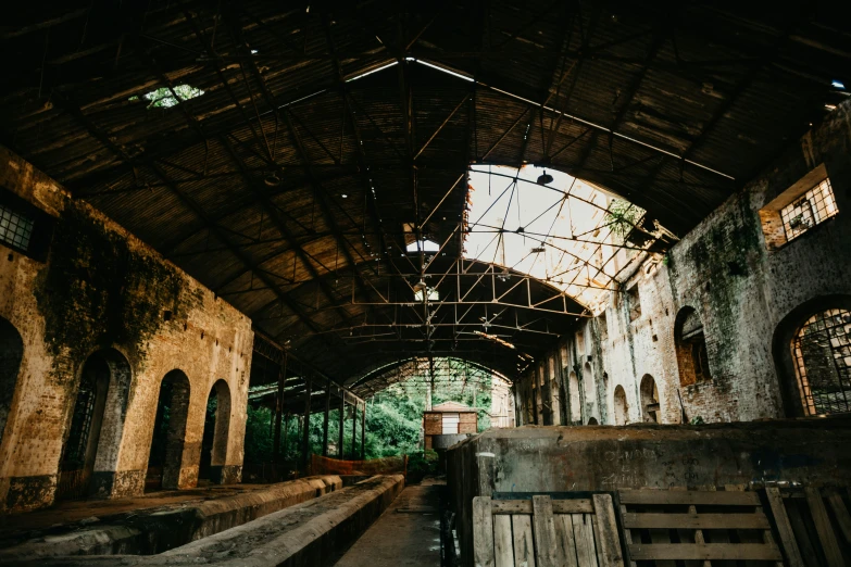 inside of a large building with lots of wood on the sides