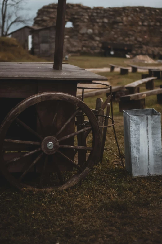 the wheel and wheel chair are next to a metal basket