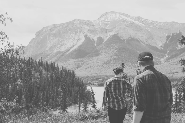 two young people on a hike admiring the mountains