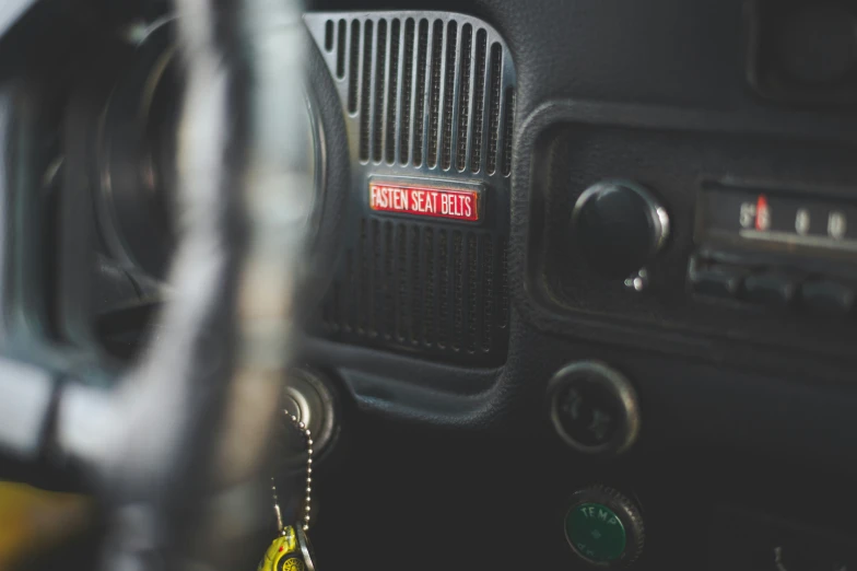 the radio of a small car with a yellow tag