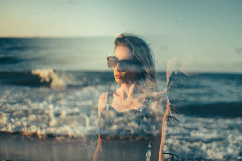 a beautiful woman holding a surf board near the ocean