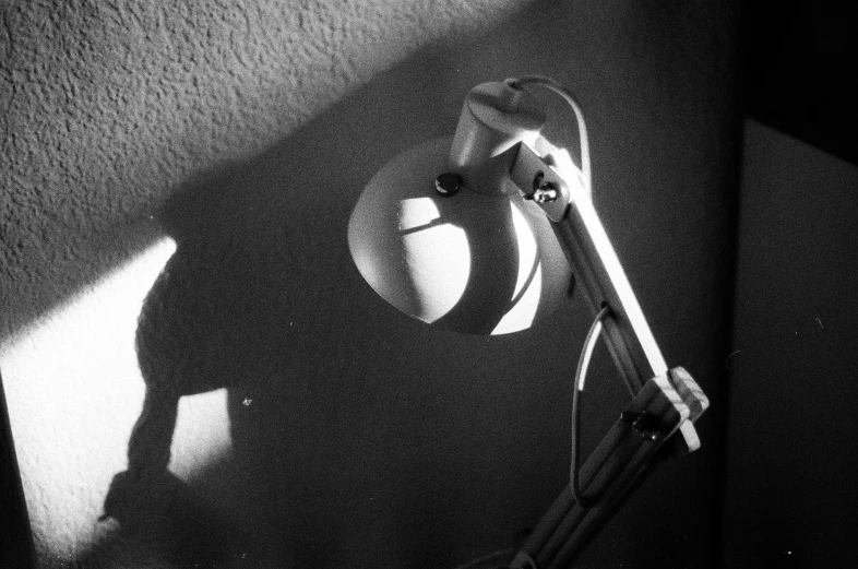 black and white image of helmet, gloves and a hairbrush