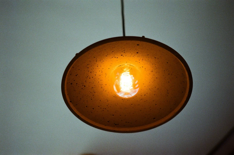 a round light with a light fixture attached