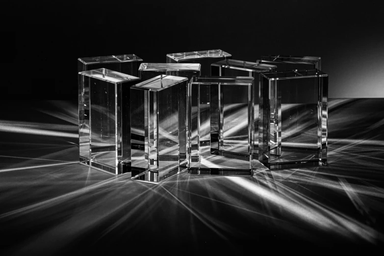 three empty vases sitting in the middle of a black and white po