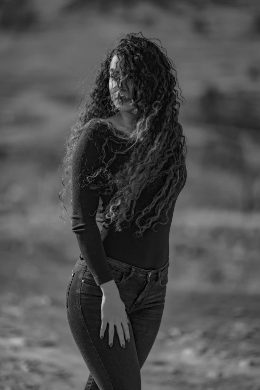 a woman with long hair and glasses skating on a skateboard