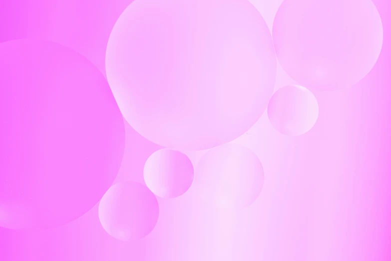 there is a pink background with three bubbles