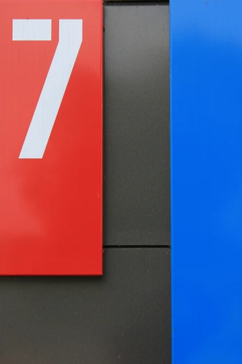 a red and blue door with a large 7 on it