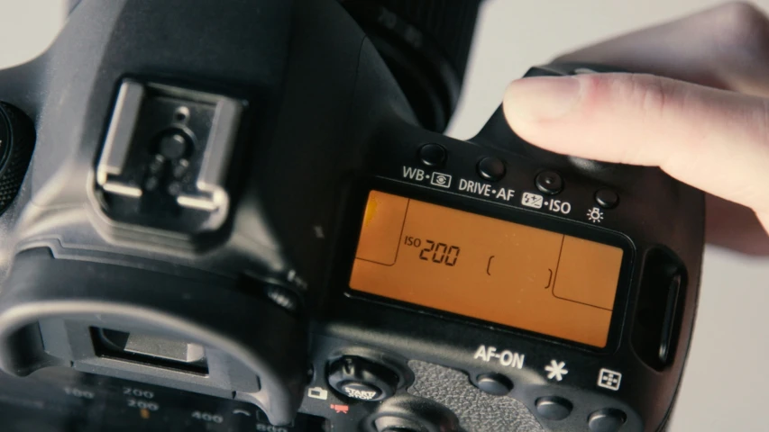 a camera being held up by someone using it